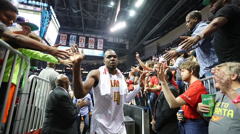 Paul Millsap of the Hawks gets high fives from fans defeating the Wizards 111-101 in Game 4 of a first-round playoff series on Monday, April 24, 2017, in Atlanta. Curtis Compton/ccompton@ajc.com