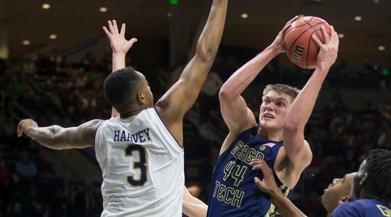 Georgia Tech's Ben Lammers (44) goes up for a shot as Notre Dame's D.J. Harvey (3) defends during the first half of an NCAA college basketball game Saturday, December 30, 2017, in South Bend, Ind. (AP Photo/Robert Franklin)