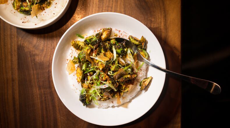 Chef Jarrett Stieber's Winter Vegetables with Rice Porridge, Scallion, Peanut and Korean Chili Flake. / Photo credit- Mia Yakel.