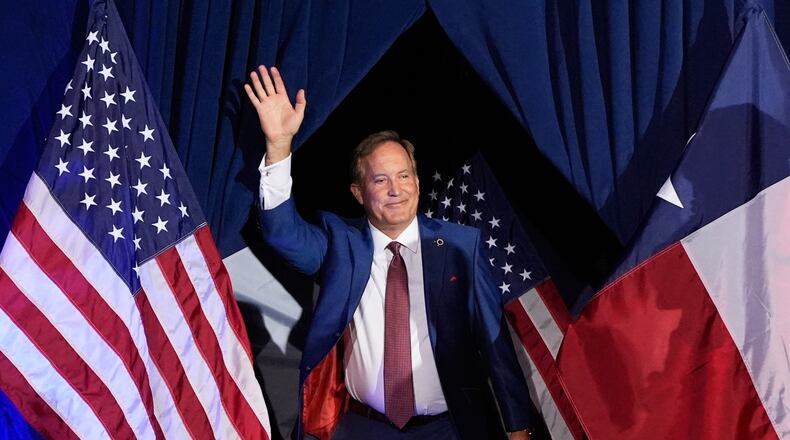 Texas Attorney General Ken Paxton, a Republican candidate for the U.S. Senate, waves as he takes the stage during a primary runoff election night event after winning the Republican party's nomination Tuesday, May 26, 2026, in Plano, Texas. (AP Photo/Tony Gutierrez)