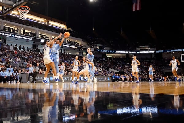 North Carolina guard Reniya Kelly (10) puts up a shot over Duke guard Ashlon Jackson (3) during the second half in the Sweet 16 of the NCAA college basketball tournament, Friday, March 28, 2025, in Birmingham, Ala. (AP Photo/Butch Dill)