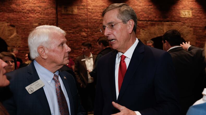 Georgia House Speaker Jon Burns (left) R-Newington, mingled with Georgia Secretary of State Brad Raffensperger earlier this year at the Wild Hog Supper in Atlanta. (Miguel Martinez/AJC)