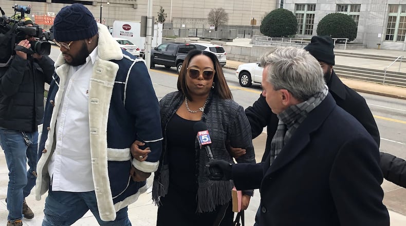 A former top aide to former Mayor Kasim Reed, Katrina Taylor-Parks (center), enters federal court in Atlanta Jan. 14. She pleaded guilty last year, admitting to taking bribes from a city vendor.