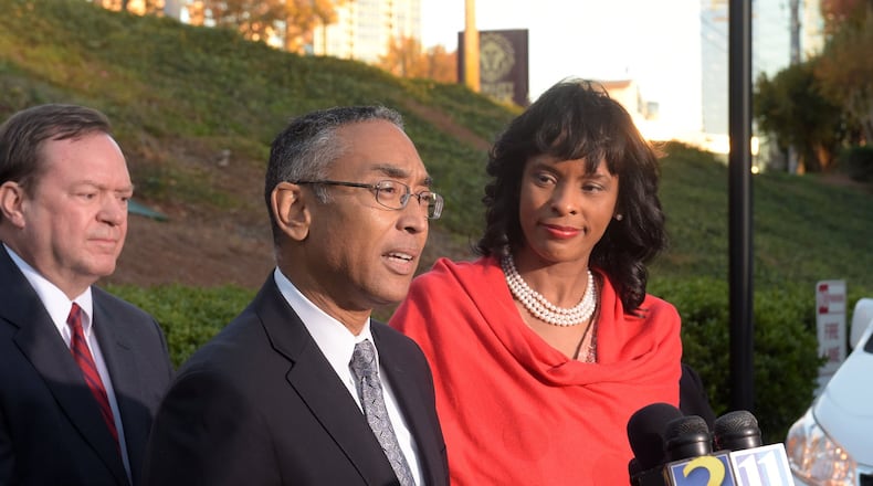DeKalb CEO Burrell Ellis, with his wife Philippa, and defense attorney Craig Gillen, speaks during a press conference Thursday, Dec. 1, 2016, for the first time since he was convicted a year and a half ago following a second trial in DeKalb County. The Georgia Supreme Court threw out Ellis’ guilty verdicts on Wednesday. KENT D. JOHNSON/kdjohnson@ajc.com