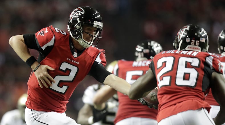 Atlanta Falcons quarterback Matt Ryan (2) hands the ball to running back Tevin Coleman (26) during the regular season finale against the New Orleans Saints Sunday, Jan. 1, 2017, at the Georgia Dome in Atlanta.