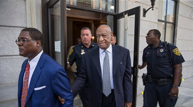 NORRISTOWN, PA - AUGUST 22: Bill Cosby, center, leaves the Montgomery County Courthouse, led by Andrew Wyatt, left, and behind his new legal team, after details of the new trial were decided by the court August 22, 2017 in Norristown, Pennsylvania. Bill Cosby and his new lawyers will have a hearing in Montgomery County Court about dropping his old counsel, adding his new counsel and if the jury pool will be taken out of county again. (Photo by Michael Bryant-Pool/Getty Images)