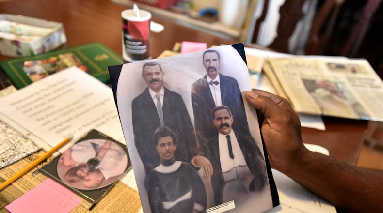 January 26, 2016 Lihtonia - Johnny Waits, president of the Flat Rock Archives, holds his old family photograph at the Flat Rock Archives in Lithonia on Tuesday, January 26, 2016. Flat Rock is one of the area's oldest black communities. . HYOSUB SHIN / HSHIN@AJC.COM