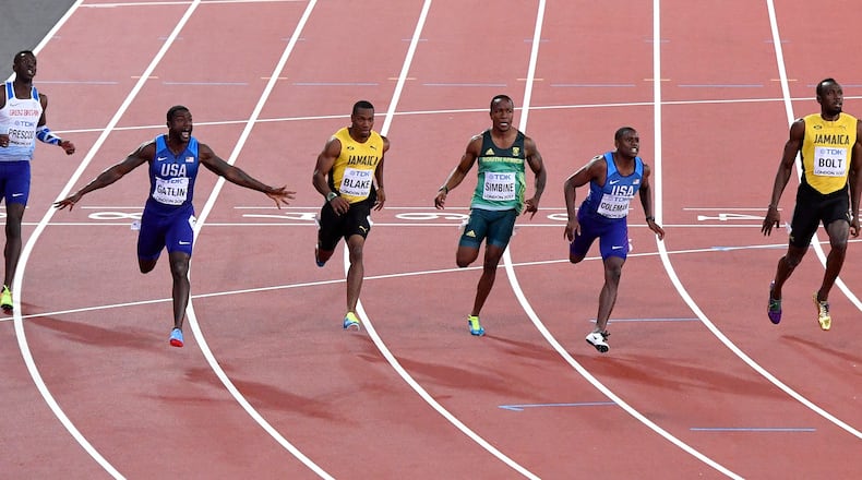 United States' Justin Gatlin, second left, celebrates as he wins the Men's 100 meters final during the World Athletics Championships in London Saturday, Aug. 5, 2017. United States' Christian Coleman, second right was second and Jamaica's Usain Bolt, right, was third. (AP Photo/Martin Meissner)