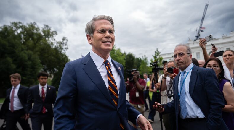 Treasury Secretary Scott Bessent walks past reporters following an interview with Fox News outside the White House, Thursday, July 30, 2026, in Washington. (AP Photo/Julia Demaree Nikhinson)
