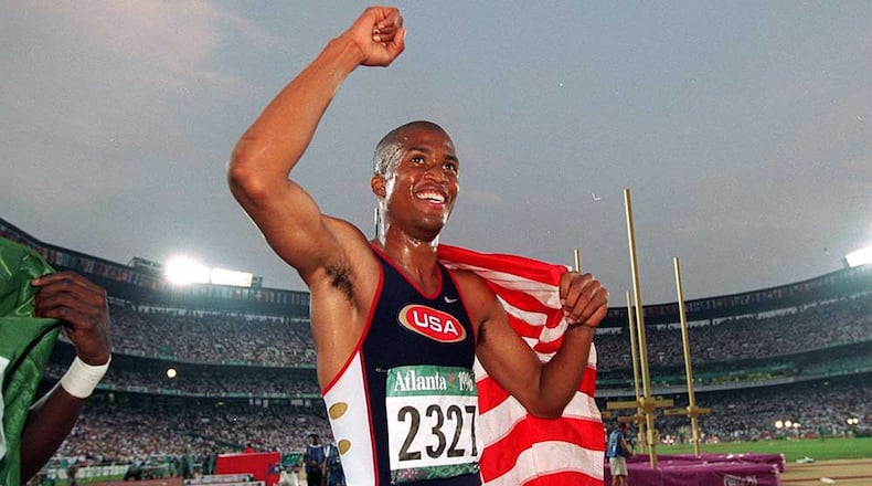 Georgia Tech grad Derrick Adkins celebrates win in the 400-meter hurdles at the Olympic stadium on Thursday, August 1, 1996 during the 1996 Summer Olympic Games in Atlanta. (AJC Staff Photo/Rich Addicks) 8/96