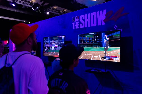 ARLINGTON, TX - JULY 13: Fans play MLB: The Show during the 2024 Capital One All-Star Village  at Globe Life Field on Saturday, July 13, 2024 in Arlington, Texas. (Photo by Ray Bahner/MLB Photos via Getty Images)