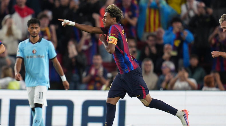 Barcelona's Lamine Yamal celebrates after scoring his side's fourth goal during the Champions League opening phase soccer between Barcelona and Feyenoord in Barcelona, Spain, Wednesday, Sept. 9, 2026.(AP Photo/Emilio Morenatti)