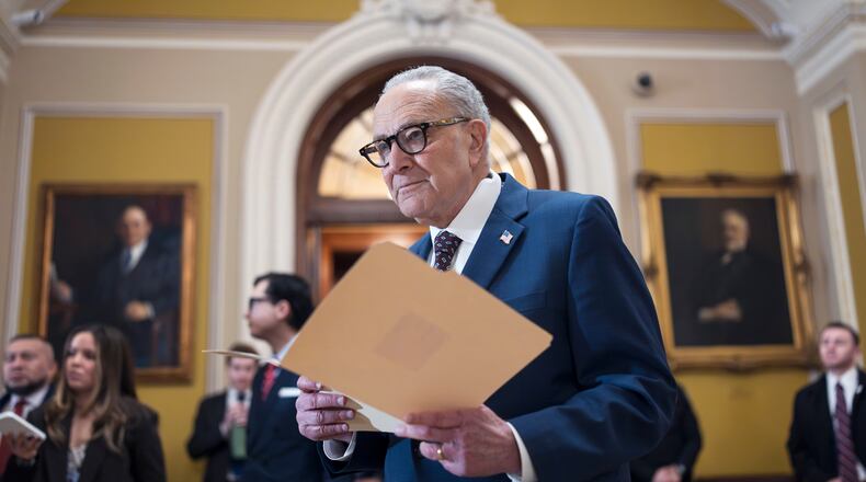 FILE—Senate Minority Leader Chuck Schumer, D-N.Y., waits to speak to reporters following a closed-door meeting with fellow Democrats on spending legislation that funds the Department of Homeland Security and a swath of other government agencies as the country reels from the deaths of two people at the hands of federal agents in Minneapolis, at the Capitol in Washington, Wednesday, Jan. 28, 2026. (AP Photo/J. Scott Applewhite, File)