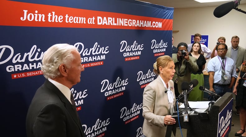 Gov. Henry McMaster, R-S.C., left, looks on as Sen. Darline Graham, R-S.C., speaks at a news conference for her campaign a day ahead of the special GOP Senate runoff to replace her brother, the late Sen. Lindsey Graham, R-S.C., Monday, Aug. 24, 2026, in Columbia, S.C. (AP Photo/Meg Kinnard)