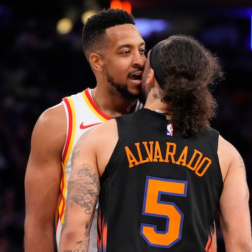 Atlanta Hawks guard CJ McCollum, left, argues with New York Knicks guard Jose Alvarado (5) during the second half in Game 2 of a first-round NBA playoffs basketball series, Monday, April 20, 2026, in New York. (AP Photo/Yuki Iwamura)