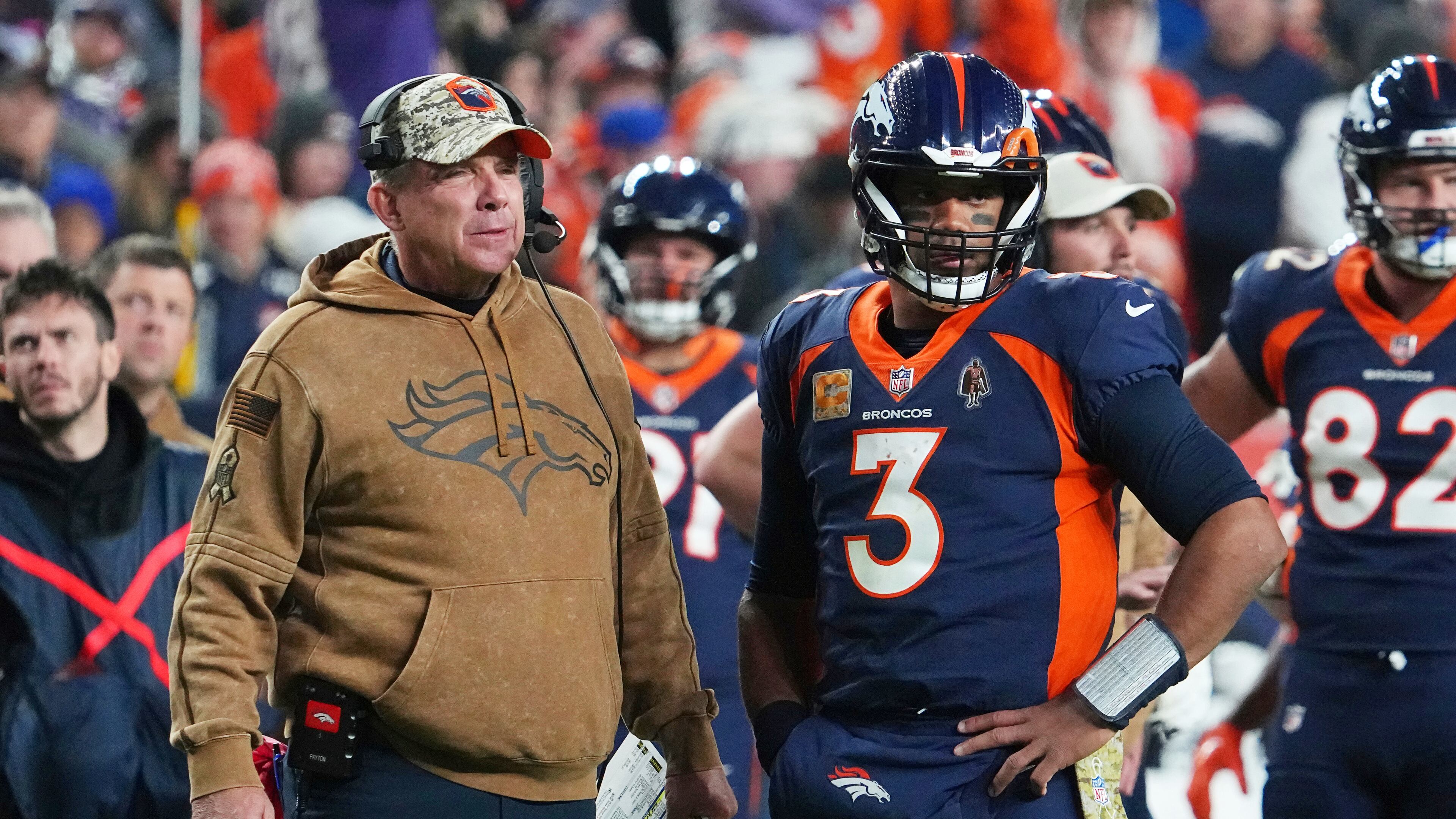 FILE - Denver Broncos head coach Sean Payton and quarterback Russell Wilson (3) look on during a timeout in an NFL football game against the Minnesota Vikings, Nov. 19, 2023, in Denver. (AP Photo/Bart Young, File)