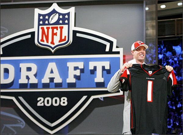 Quarterback Matt Ryan shows off a Falcons jersey after getting drafted in 2008. (AP)