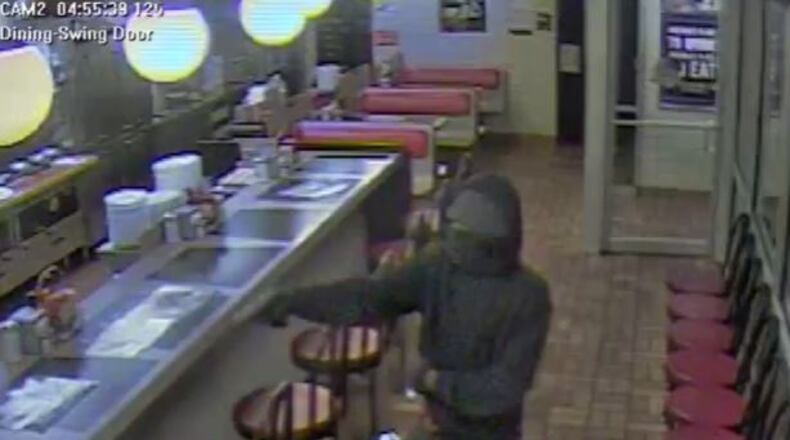 DeKalb police released video of a man holding up a Waffle House. He is wanted and unidentified.