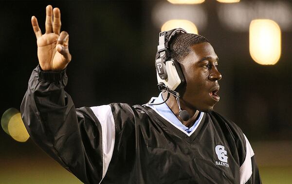 Cedar Grove's head coach Jermaine Smith signals his players. (Phil Skinner/Special to AJC)
