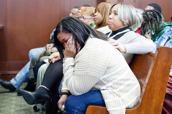 Family members listen to the statement of Melvin Cooksey’s daughter during the sentencing hearing of Danetta Knoblauch on Wednesday, Dec. 10, 2025. (Miguel Martinez/AJC)