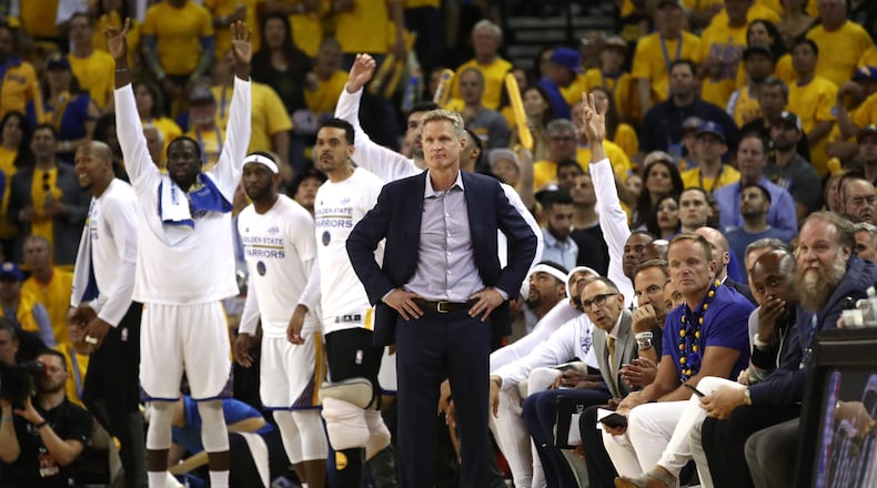 Coach Steve Kerr and the Warriors' bench looks on during action in Game 2.