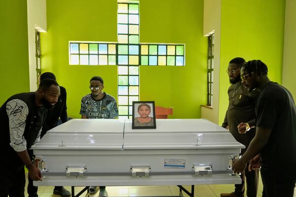 Mourners carry the casket of Nigerian Ladi Anzaki Olubunmi, a TikTok content moderator employed by subcontractor Teleperformance, at Chiromo Funeral Parlour in Nairobi, Kenya Thursday, April. 17, 2025. (AP Photo/Brian Inganga)