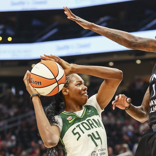 Seattle Storm center Dominique Malonga (14) looks to shoot as Minnesota Lynx forward Natasha Howard defends during a WNBA basketball game, Wednesday afternoon, July 22, 2026, in Seattle. (Kevin Clark/The Seattle Times via AP)