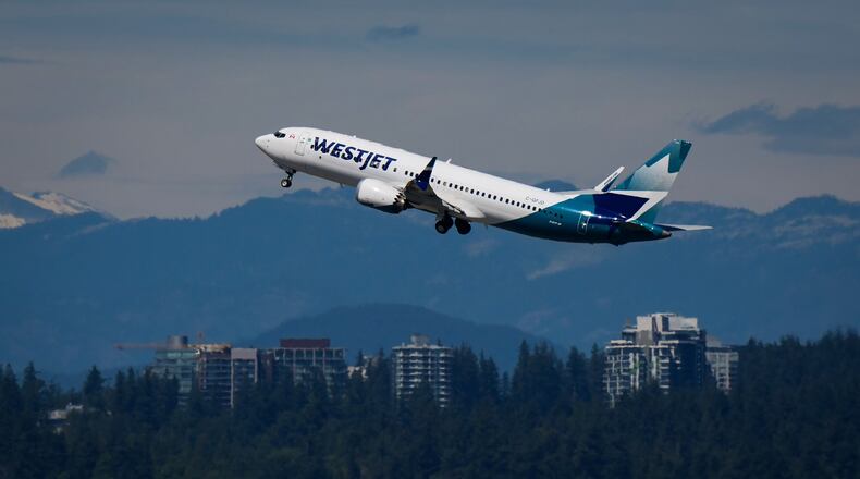 A WestJet Boeing 737 Max aircraft takes off from Vancouver International Airport in Richmond, British Columbia, Canada, on Friday, July 31, 2026. (Darryl Dyck/The Canadian Press via AP)