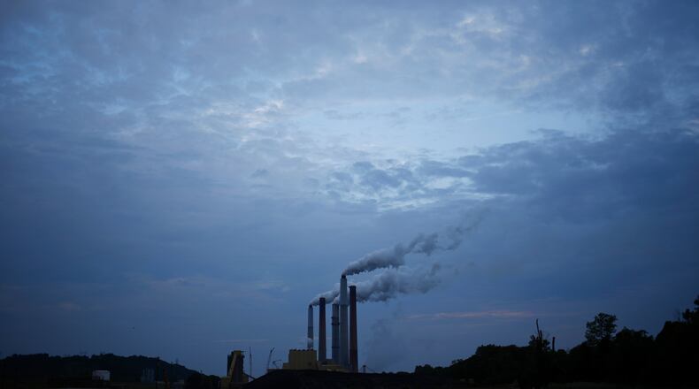 Emissions from a coal-fired power plant drift skyward in Ghent, Ky., June 2, 2014. (Luke Sharrett/The New York Times)
