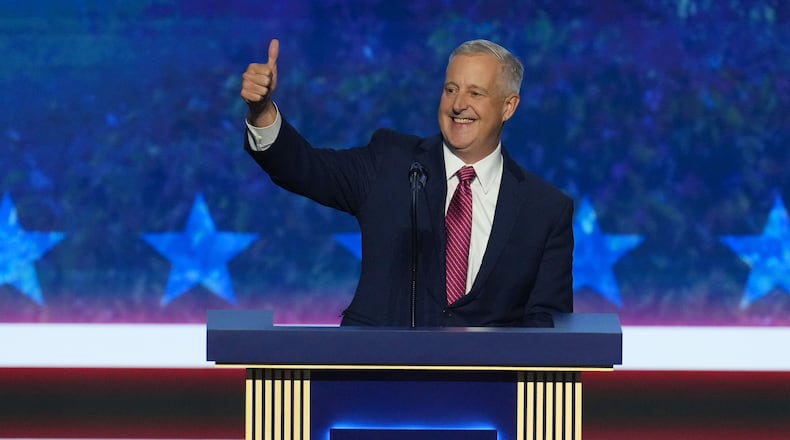 Michael Whatley, North Carolina senatorial candidate, greets delegates as he takes the stage at the Republican convention in Dallas, Wednesday, Sept. 9, 2026. (AP Photo/Tony Gutierrez)