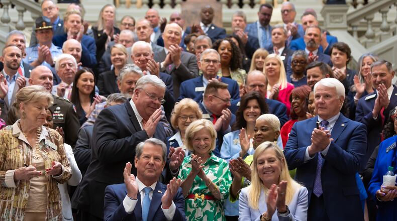 Gov. Brian Kemp, center left, signed a $36.1 billion budget for fiscal 2025, which begins July 1. It appears that when the state closes the books on fiscal 2024 at the end of the month it will have a surplus of $2 billion to $3 billion. (John Spink/AJC)