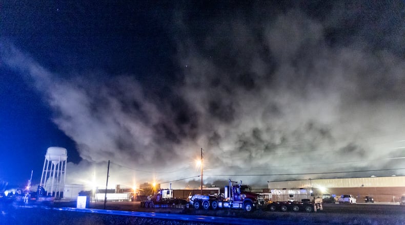 The plume of smoke rising from BioLab as seen from Old Covington Highway continued on Thursday, Oct. 3, 2024, in Conyers. A Sunday fire at the chemical plant in Conyers has had agencies monitoring the air quality since then as crews try to neutralize the site. Rockdale County officials said the plume is changing colors as workers remove debris. (John Spink/AJC)