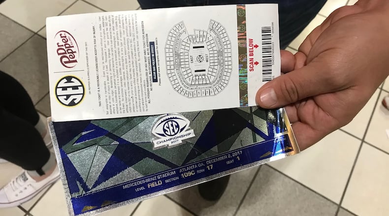 Counterfeit tickets remain a problem in college football. Georgia fans who drove to Atlanta Dec. 2 for the SEC championship game with Auburn bought these tickets for $300 each before finding out at the gate that they were fakes. College Football Playoff officials warn against buying printed tickets from scalpers. BO EMERSON / BEMERSON@AJC.COM