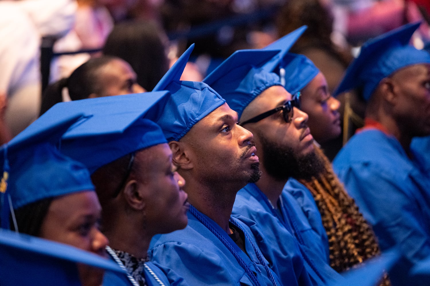 Graduates of Goodwill of North Georgia job training program and career development programs listen to a speaker during a graduation ceremony at the Georgia Aquarium in Atlanta on Monday, June 9, 2025.   Ben Gray for the Atlanta Journal-Constitution
