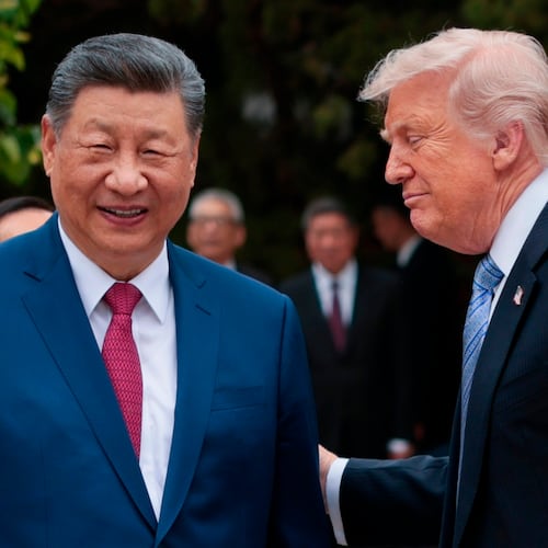 U.S. President Donald Trump, right, speaks with Chinese President Xi Jinping while leaving after a visit to the Zhongnanhai Garden in Beijing, Friday, May 15, 2026. (Evan Vucci/Pool Photo via AP)