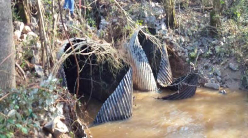Two collapsed corrugated metal culverts under Antebellum Way will be replaced with concrete. Courtesy Fayette County