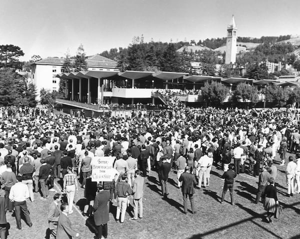 FILE - Scene on the university of California campus in Berkeley as a demonstration protesting U.S. presence in Vietnam started on Oct. 15, 1965. The spectators were entertained by folk. Singers and speeches. Later there was to be a march against the Oakland army terminal, seven miles away. Police refused to grant a parade permit, but the anti-Vietnam group leaders said they would march anyway. (AP Photo, File)