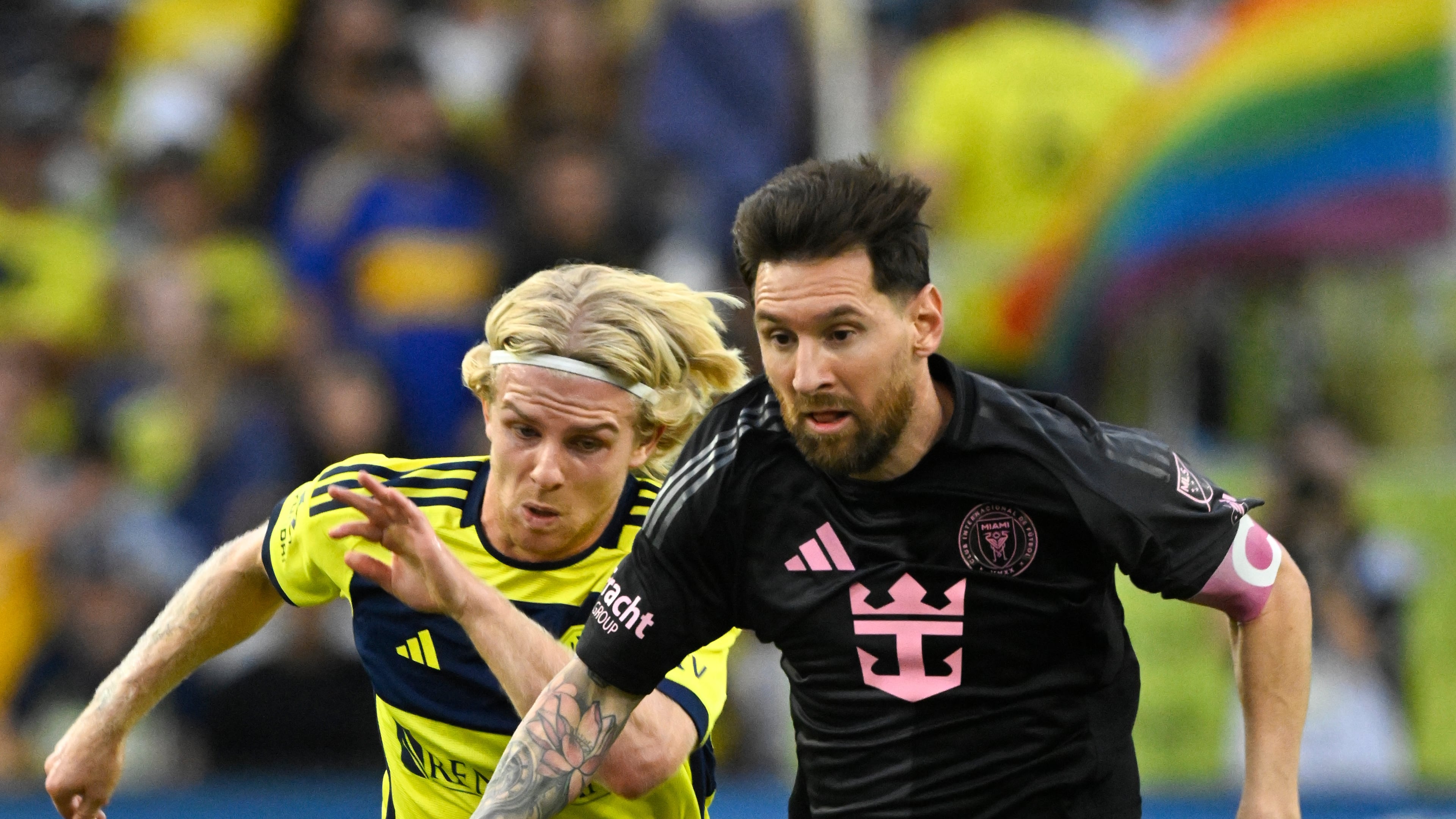 Inter Miami forward Lionel Messi (10) dribbles up the field as Nashville SC midfielder Edvard Tagseth (20) defends during the first half of a MLS soccer match Saturday, Oct. 28, 2025, in Nashville, Tenn. (AP Photo/John Amis)