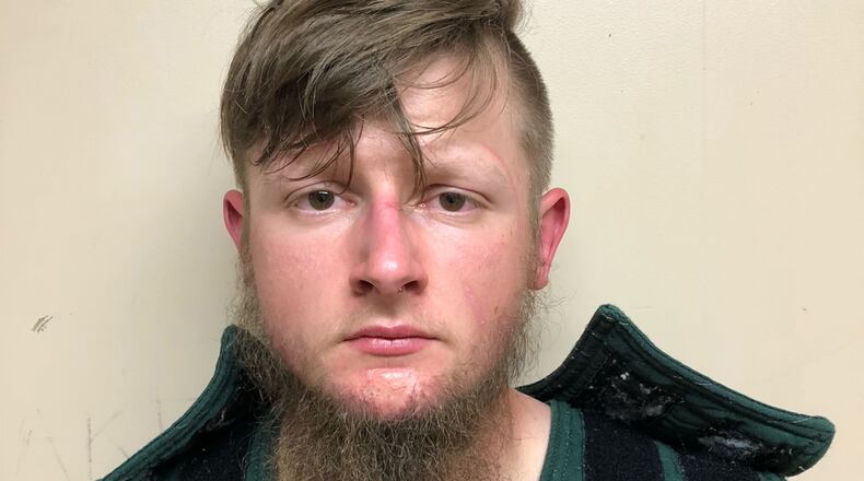 In this handout provided by the Crisp County Sheriff's Office, Robert Aaron Long is pictured in a jail booking photo on March 16, 2021, in Cordele, Georgia. Long, 21, was arrested as the suspect in a series of shootings at three Atlanta-area spas. (Crisp County Sheriff's Office/Getty Images/TNS)