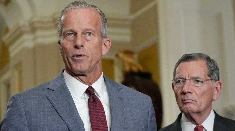 Sen. Majority Leader John Thune, R-S.D., left, speaks as Sen. John Barrasso, R-Wyo., listens during a news conference after a policy luncheon on Capitol Hill, Wednesday, July 29, 2026, in Washington. (AP Photo/Mariam Zuhaib)
