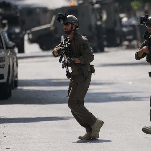 Israeli soldiers move on a street outside the Nablus Speciality Hospital in the West Bank city of Nablus, Friday, July 24, 2026, after Israeli military killed, according to health authorities, at least four Palestinians in the village of Tell in the northern West Bank. (AP Photo/Majdi Mohammed)