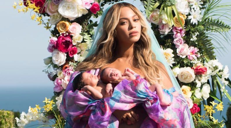 In this undated image released by Parkwood Entertainment on Friday, July 14, 2017, Beyonce posed with her newborn twins Sir Carter and Rumi. (Mason Poole/Parkwood Entertainment via AP)