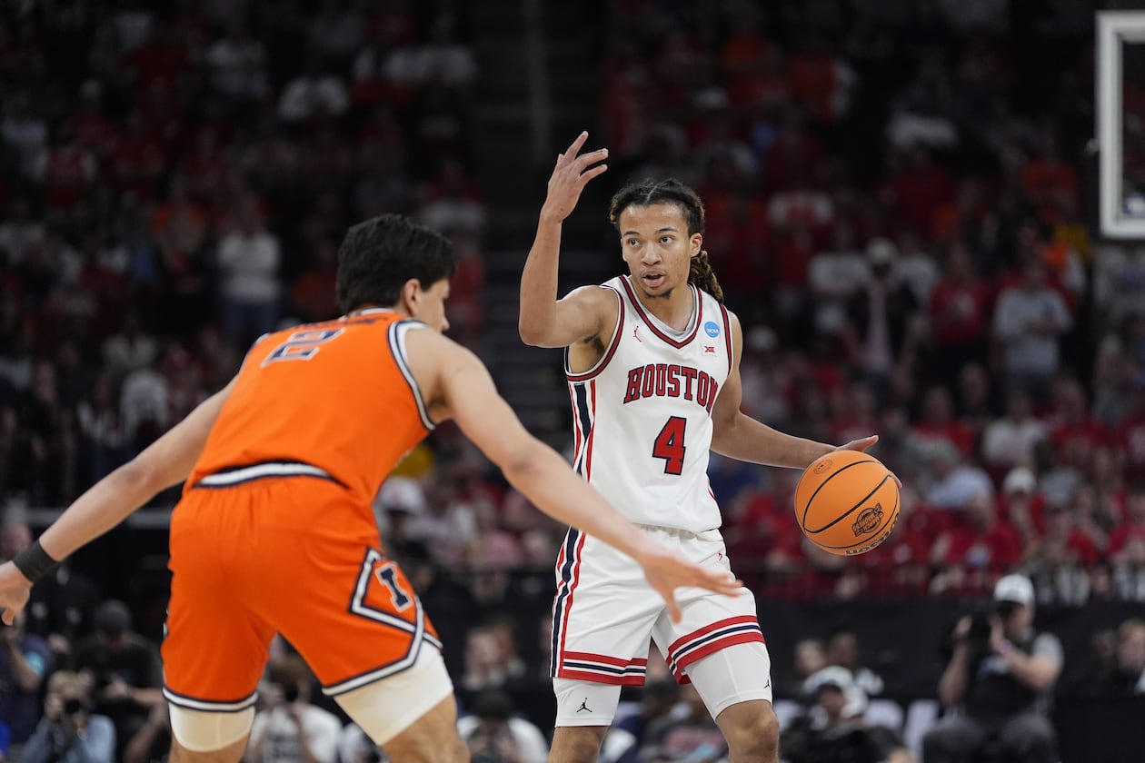 Houston guard Kingston Flemings (4) directs his teammates during the first half of a Sweet 16 game in the NCAA college basketball tournament Thursday, March 26, 2026, in Houston. (Ashley Landis/AP)