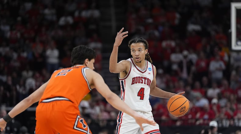 Houston guard Kingston Flemings (4) directs his teammates during the first half of a Sweet 16 game in the NCAA college basketball tournament Thursday, March 26, 2026, in Houston. (Ashley Landis/AP)