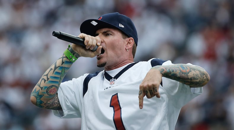 HOUSTON, TX - SEPTEMBER 15: Rapper Vanilla Ice performs for fans at a game between the Houston Texans and the Tennessee Titans at Reliant Stadium on September 15, 2013 in Houston, Texas. (Photo by Scott Halleran/Getty Images)
