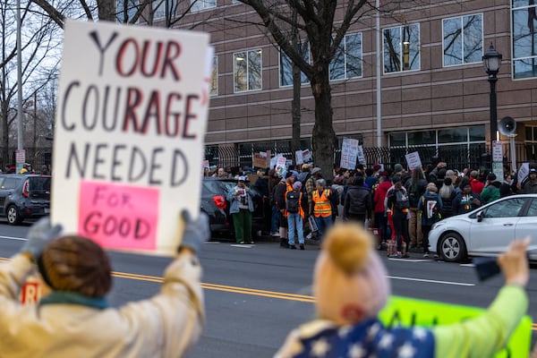 Demonstrators protest against Immigration and Customs Enforcement along both sides of Ted Turner Drive on Friday, Jan. 23, 2026, in Atlanta. Rallies were planned in other cities across the U.S. following weeks of protest and unrest. (Arvin Temkar/AJC)