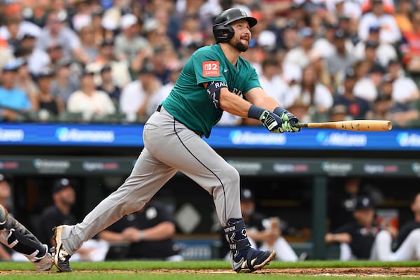 Seattle Mariners Cal Raleigh (29) hits a sacrifice fly against the Detroit Tigers in the third inning of a baseball game, Saturday, July 12, 2025, in Detroit. (AP Photo/Lon Horwedel)