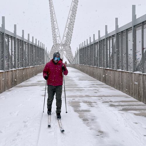 Jacob Coleman skis across SkyDance Bridge over Interstate 40 during a snowstorm in Oklahoma City on Saturday, Jan. 24, 2026. (AP Photo/Thomas Peipert)