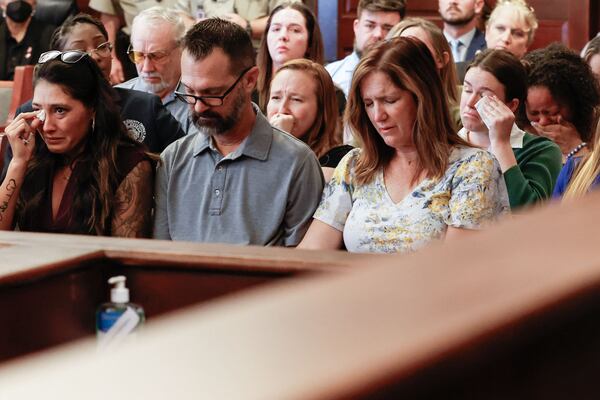 The family of 8-year-old Adalynn “Addy” Pierce cry as evidence is presented during a plea hearing at Henry County Superior Court in McDonough on Thursday. (Natrice Miller/AJC)
