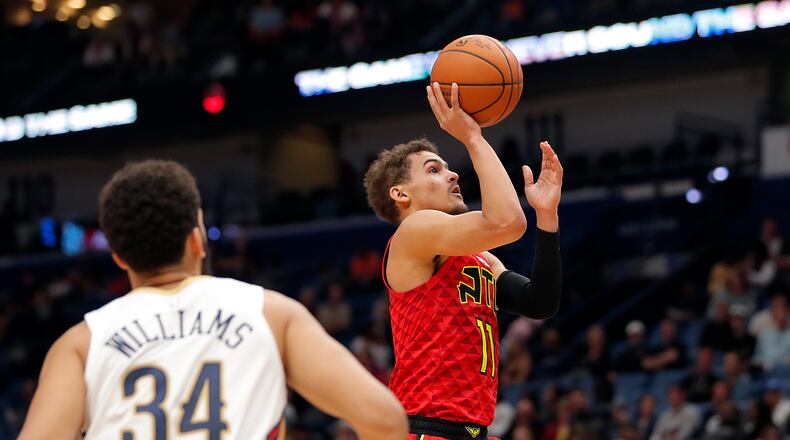Hawks guard Trae Young (11) shoots against the New Orleans Pelicans in New Orleans, Tuesday, March 26, 2019. (AP Photo/Gerald Herbert)